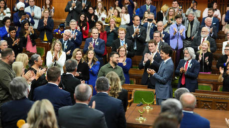 FILE PHOTO. Ukrainian President Vladimir Zelensky stands alongside Canadian Prime Minister Justin Trudeau at the Canadian Parliament