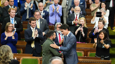 FILE PHOTO: Ukrainian President Volodymyr Zelensky (C, R) is greeted by Canadian Prime Minister Justin Trudeau in Ottawa, Canada, on September 22, 2023.