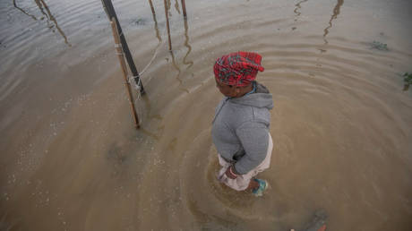 FILE PHOTO: People fetching their belongings from their flooded homes on July 01, 2021 in Cape Town, South Africa.