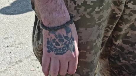 FILE PHOTO. Nazi tattoo seen on the hand of a surrendered Ukrainian military serviceman