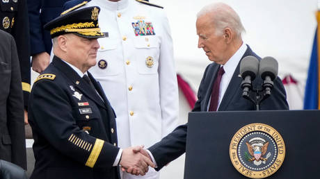 Outgoing US Chairman of the Joint Chiefs of Staff Mark Milley shakes hands with President Joe Biden at his retirement ceremony on Friday in Arlington, Virginia.