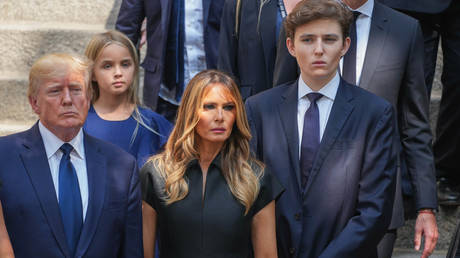 Donald Trump, Melania Trump and Barron Trump are seen at the funeral of Ivana Trump on July 20, 2022 in New York City