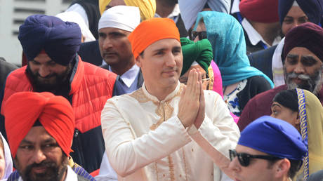 Canadian Prime Minister Justin Trudeau pays his respects at the Sikh Golden Temple in Amritsar on February 21, 2018