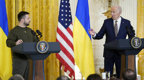 US President Joe Biden (R) speaks during a news conference with Ukrainian President Vladimir Zelensky at the White House in Washington DC, December 21, 2022