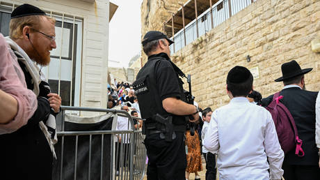 FILE PHOTO: A member of Israel's security services stands guard at Jerusalem’s Western Wall during the Jewish holiday of Sukkot, October 4, 2023.