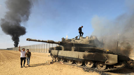 A destroyed Israeli Merkava tank pictured on Israel-Gaza border in Gaza Strip, Gaza on October 07, 2023.