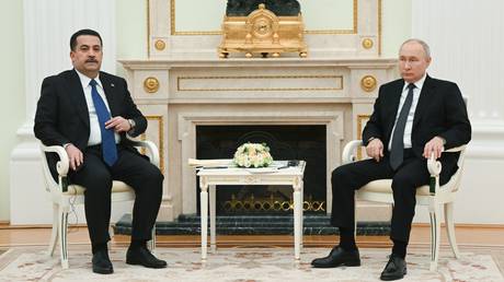 Iraqi Prime Minister Mohammed Shia Al Sudani and Russian President Vladimir Putin attend a meeting at the Kremlin in Moscow, Russia.