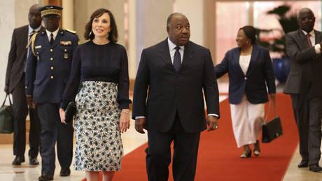 FILE PHOTO: Gabonese President Ali Bongo (C) and his wife Sylvia (3-L) arrive to the Presidential Palace on March 28, 2017 in Libreville.