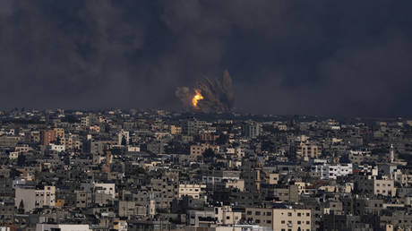 Fire and smoke rise following an Israeli airstrike, in Gaza City, Sunday, Oct. 8, 2023.