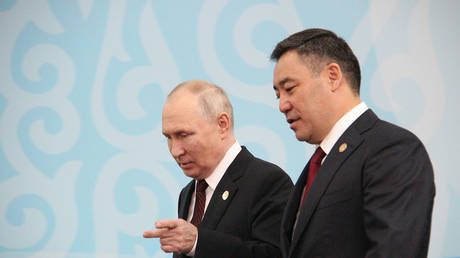BISHKEK, KYRGYZSTAN - OCTOBER 13: Kyrgyz President Sadyr Japarov (R) greets Russian President Vladimir Putin (L) during the CIS Summit in Bishkek.