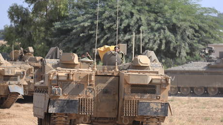 Israeli army deploy dozens of tanks and armored vehicles along with military members to the Gaza border area in Sderot, Israel on October 13, 2023