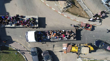 Palestinians flee from northern Gaza after the Israeli Army issued an evacuation warning ahead of a potential ground invasion, October 13, 2023