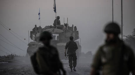 Israeli tanks move near Gaza border on October 12, 2023.
