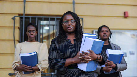 FILE PHOTO: Mercy Mutemi (C), one of the lawyers of the plaintiffs, makes statements after suing a social networking website, Facebook on December 14 in Nairobi, Kenya.