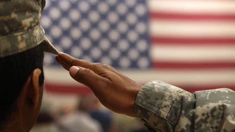 FILE PHOTO: A soldier salutes the flag during a welcome home ceremony for troops arriving from Afghanistan on June 15, 2011 to Fort Carson, Colorado.