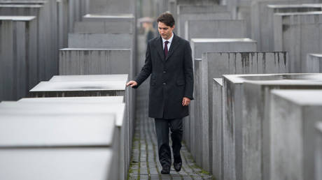FILE PHOTO: Canadian Prime Minister Justin Trudeau walks past the Memorial to the Murdered Jews of Europe in Berlin, Germany, on 17 February 2017