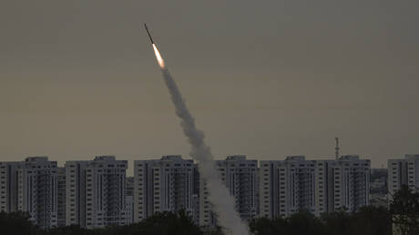 FILE PHOTO: Israel's Iron Dome air defense system fires to intercept a rocket launched from the Gaza Strip, near Ashkelon, Israel, May 11, 2023.