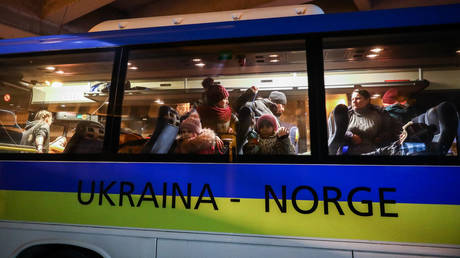 FILE PHOTO: Refugees from Ukraine are seen on a bus leaving to Norway from the station in Krakow, Poland, March 17, 2022.