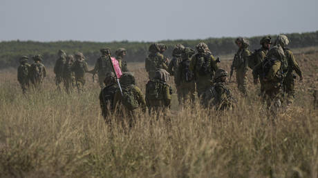 Israeli soldiers conduct a patrol near the Israel-Gaza border in southern Israel, October 20, 2023.