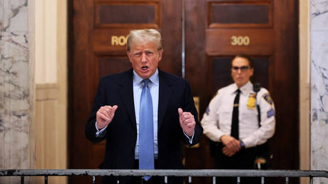 Former President Donald Trump speaks after returning from a break during his civil fraud trial at New York State Supreme Court on October 18, 2023.