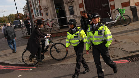Metropolitan Police officers patrol ultra-Orthodox Jewish communities in Stamford Hill, London, October 13, 2023.