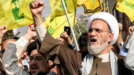 Shiite Muslim clerics chant slogans during an anti-Israel rally organized by supporters of the Lebanese movement Hezbollah in Lebanon's southern city of Nabatieh on October 13, 2023.