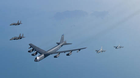 FILE PHOTO. A US Air Force B-52H bomber (C), and South Korean Air Force F-15K and KF-16 fighter jets.