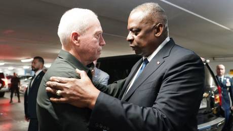 US Secretary of Defense Lloyd Austin (right) embraces his Israeli counterpart, Yoav Gallant, at a meeting earlier this month in Tel Aviv.