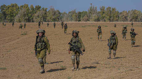 Israeli soldiers patrol near Gaza border, Friday, October 20, 2023.