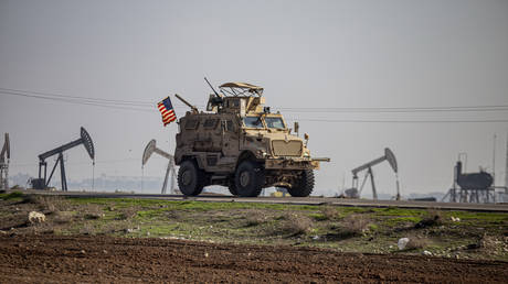FILE PHOTO: US military vehicle is seen on a patrol in the countryside near the town of Qamishli, Syria, Dec 4, 2022