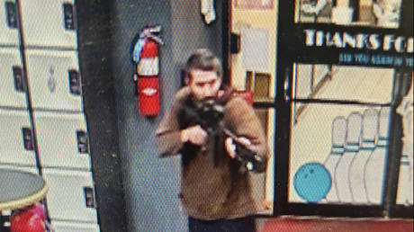 A screengrab from a video released by the Androscoggin County Sheriff's Office, showing an unidentified gunman entering Sparetime Recreation in Lewiston, Maine, October 25, 2023