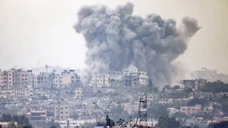 A smoke plume ascending following Israeli bombardment in the northern Gaza Strip.