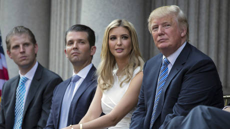 FILE PHOTO: Donald Trump sits with his children, from left, Eric, Donald Jr., and Ivanka Trump during a groundbreaking ceremony for the Trump International Hotel  in Washington DC, July 23, 2014
