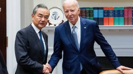 Chinese Foreign Minister Wang Yi meets with US President Joe Biden on Friday at the White House.