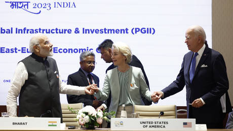 EU Commission President Ursula von der Leyen joins hands with US President Joe Biden and Indian Prime Minister Narendra Modi at the Partnership for Global Infrastructure and Investment event, during the G20 Summit in New Delhi, Sept. 9, 2023.