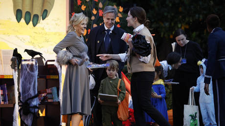 U.S. first lady Jill Biden greets Secretary of State Antony Blinken, his wife White House Cabinet Secretary Evan Ryan and their children during a Halloween trick-or-treat event at the White House