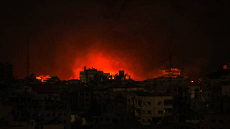 Flames and smoke rise in Tel al-Hawa neighborhof the Gaza City on October 30, 2023. (Photo by  via Getty Images)