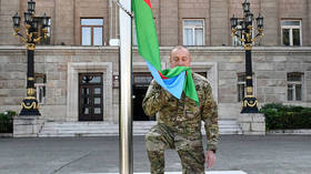 Azerbaijan leader raises flag in recaptured majority Armenian exclave