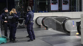 Paris police shoot woman who threatened train suicide bomb