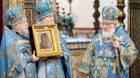 Patriarch Kirill displays the Our Lady of Kazan icon that had been considered lost for over a century, at the Kazan Cathedral in Red Square.
