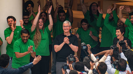 Apple Inc. Chief Executive Officer (CEO) Tim Cook reacts to the crowd during the launch of the new Apple Inc. store in New Delhi, India on April 20, 2023.