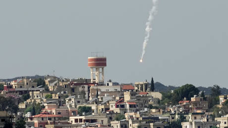 An Israeli military flare is seen over Aita al-Shaab, a Lebanese border village with Israel in south Lebanon, November 13, 2023.