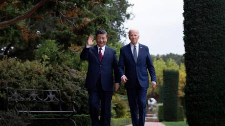 US President Joe Biden (R) and Chinese President Xi Jinping walk together after a meeting during the Asia-Pacific Economic Cooperation (APEC) Leaders' week in Woodside, California on November 15, 2023.