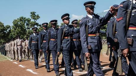  Kenya police officers march in Kisumu, Kenya, on June 1, 2018.