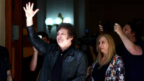 Presidential candidate for La Libertad Avanza Javier Milei leaves UTN University after casting his vote next to his sister Karina Milei during the presidential runoff on November 19, 2023 in Buenos Aires, Argentina.