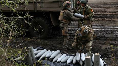 Ukrainian artillerymen of the Aidar battalion work with artillery shells on a front line position in Donetsk region, on April 22, 2023.