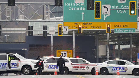 Law enforcement personnel block off the entrance to the Rainbow Bridge, Wednesday, November 22, 2023