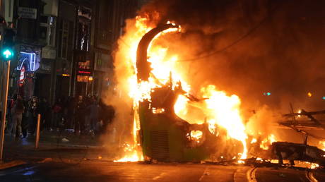 A bus on fire on O'Connell Street in Dublin city centre after violent scenes unfolded following an attack on Parnell Square East where five people were injured, including three young children, on November 23, 2023.