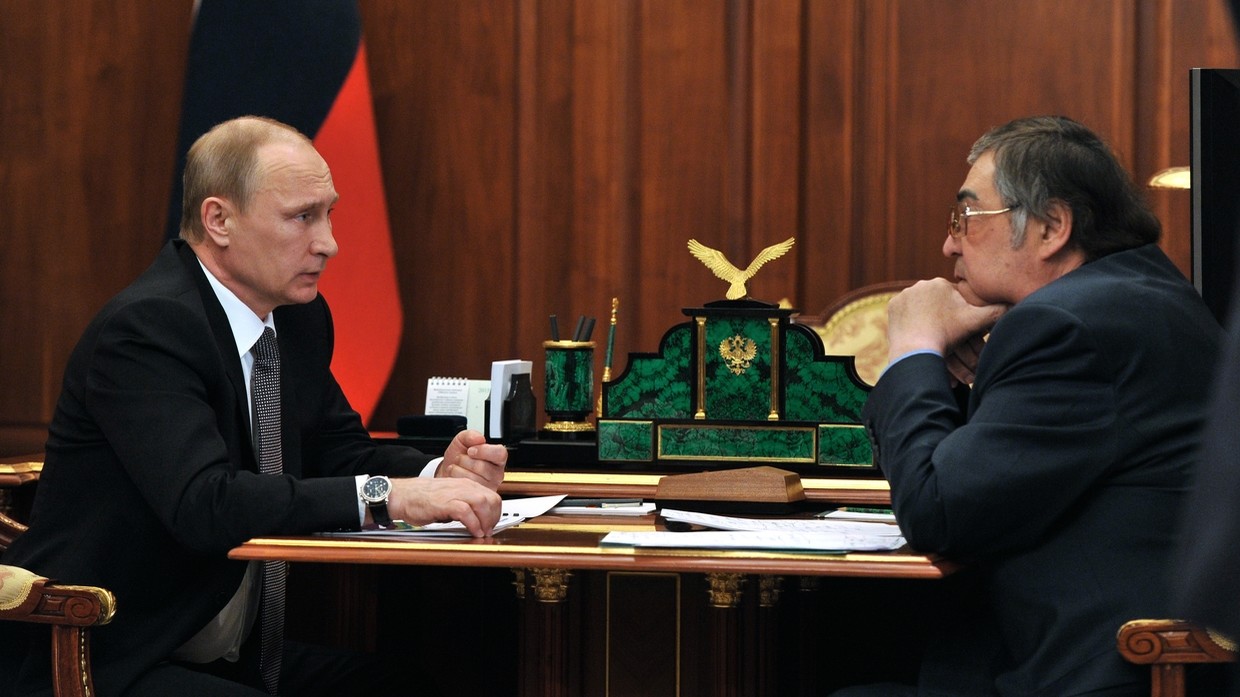 FILE PHOTO: Russian President Vladimir Putin meets then-Governor of Kemerovo Region Aman Tuleev in 2015.