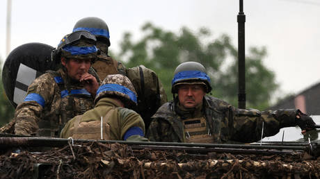FILE PHOTO: Ukrainian troops ride an armored personnel carrier.